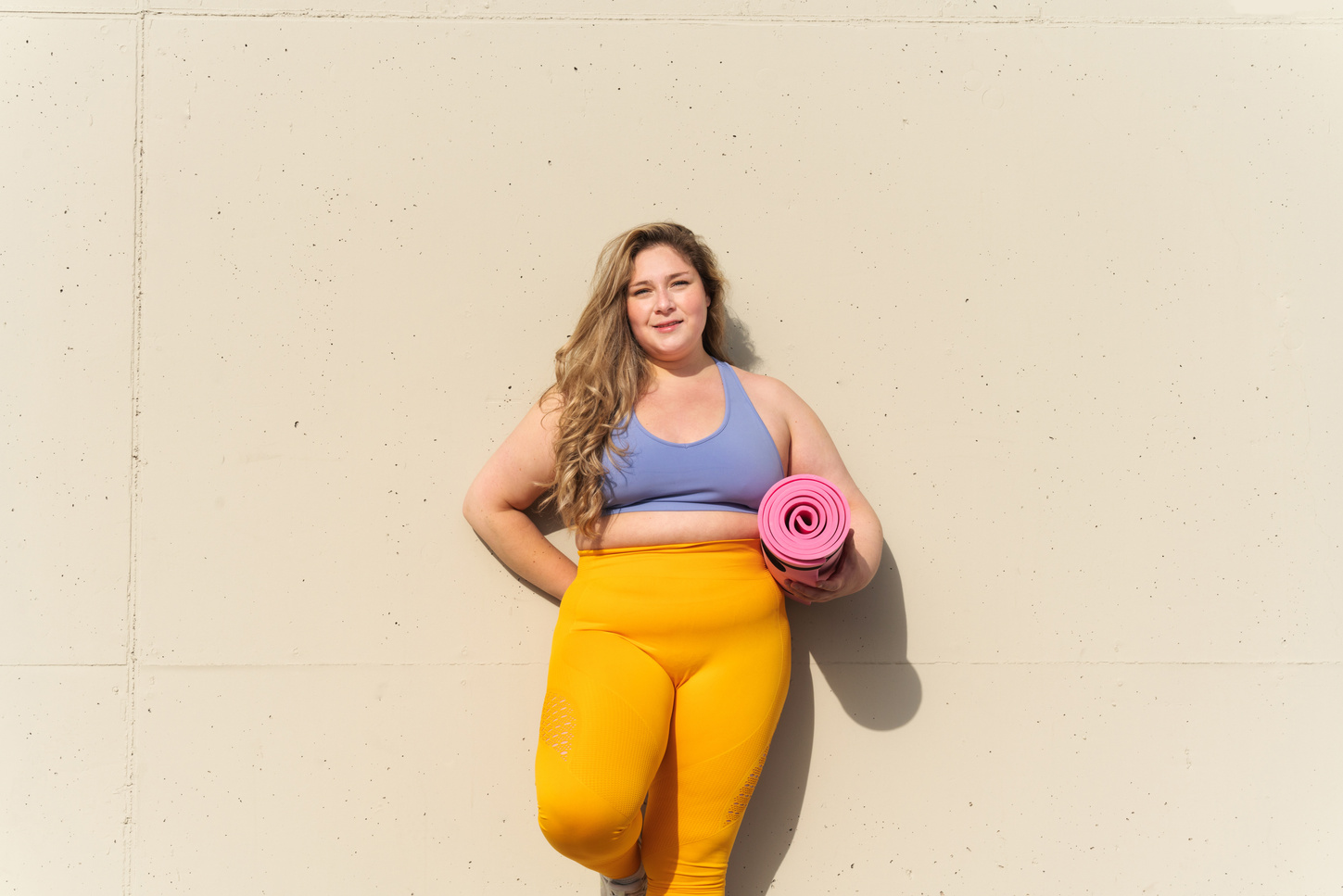 Portrait of a Plus Size Woman with Yoga Mat